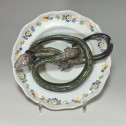 Alcora earthenware plate decorated in trompe-l'oeil - Eighteenth century