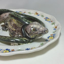 Alcora earthenware plate decorated in trompe-l'oeil - Eighteenth century