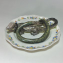 Alcora earthenware plate decorated in trompe-l'oeil - Eighteenth century